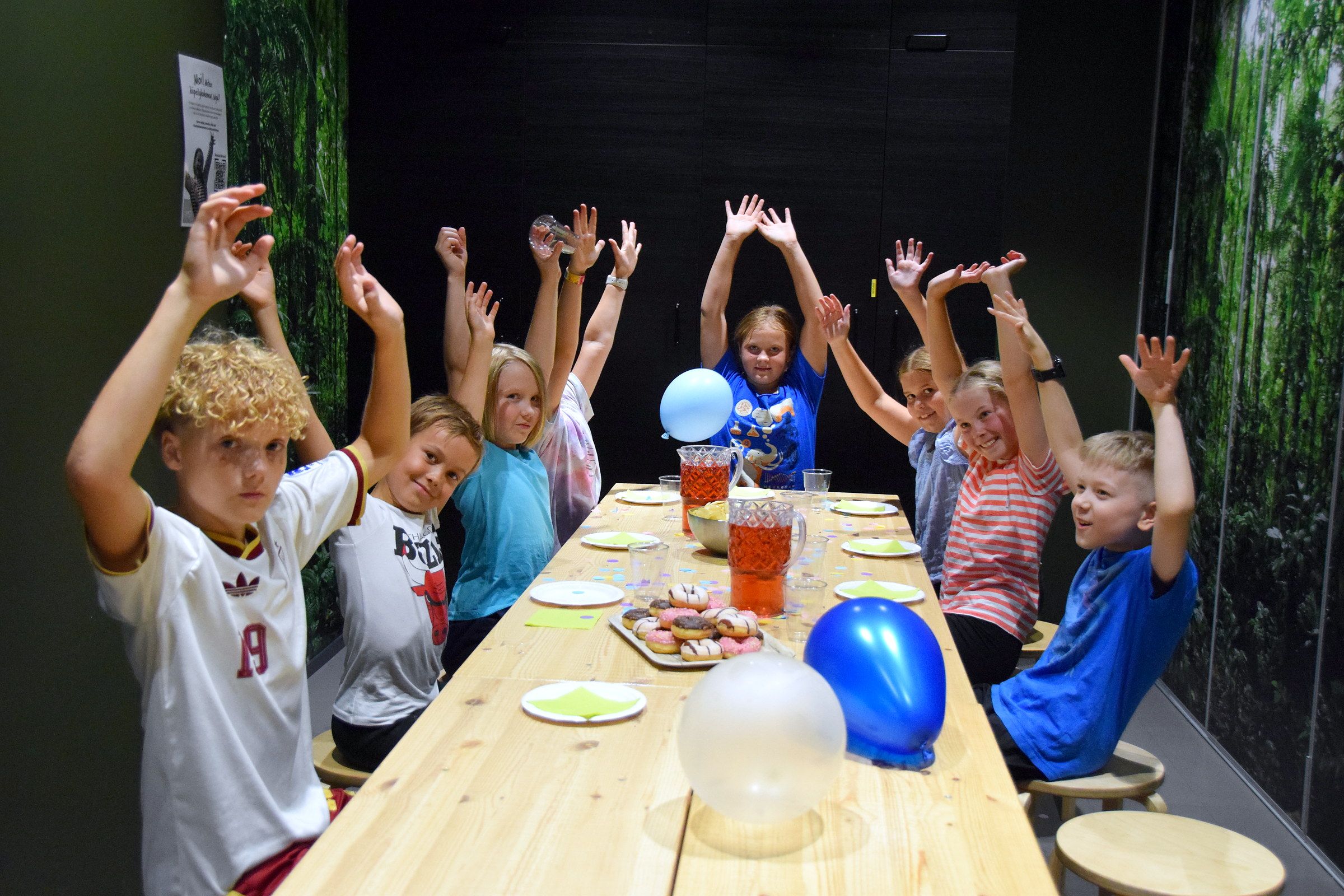 Party guests around the birthday table